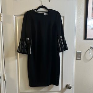 Black dress with studded silver flutter sleeves